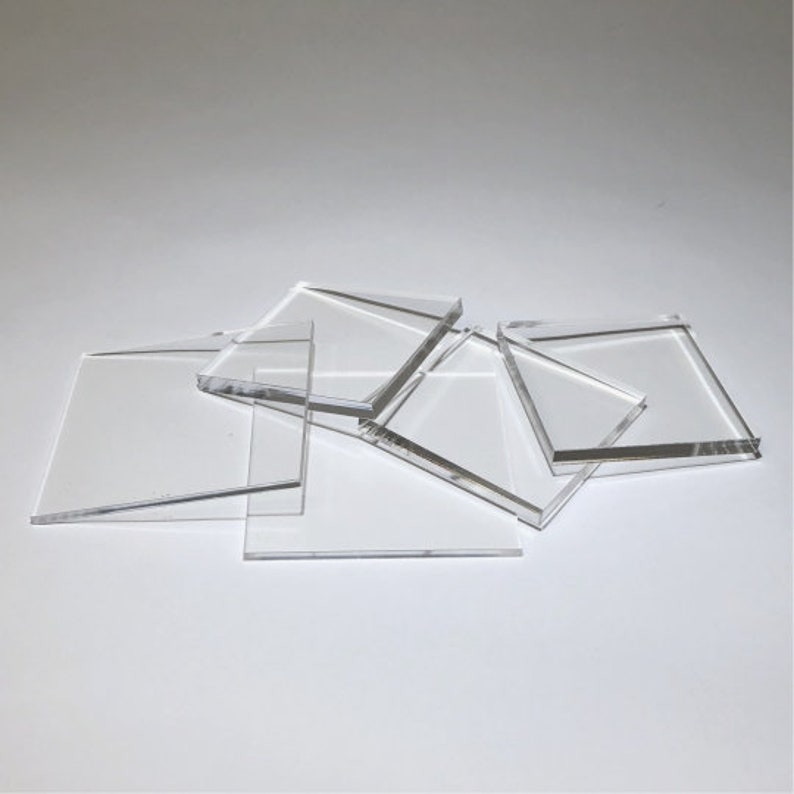 May include: A set of five clear acrylic squares of various sizes. The squares are stacked on top of each other.