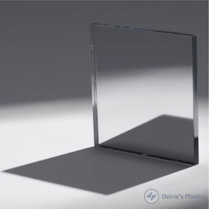 May include: A clear, rectangular sheet of acrylic plastic. The sheet is smooth and reflective, with a slight sheen.