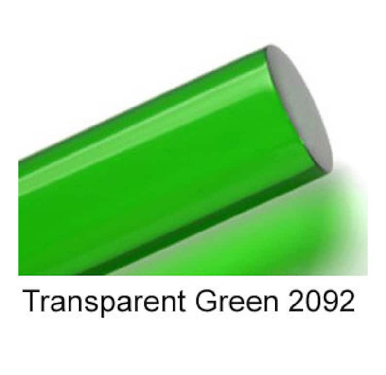 May include: A close-up of a bright green, transparent, round rod. The rod is smooth and shiny. The text "Transparent Green 2092" is printed below the rod.