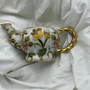 Vintage cloisonné enamel small teapot ornament. No lid. Yellow and pink flowers green leaves gold tone metal. 133g weight