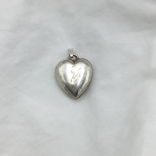 Vintage 1950s Sterling Silver small heart fancy charm or pendant engraved stylised floral leaves front. Good condition. Weight 1.1g