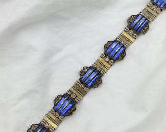 Pulsera vintage de plata esterlina, estilo Art Déco hasta la década de 1940, con cristal azul y un elegante diseño modernista. Firmada en México.