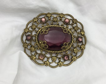 Vintage Art Deco purple glass amethyst paste glass oval brass flower detail brooch size medium large 5.2cm x 4.5cm widest. Probably Czech