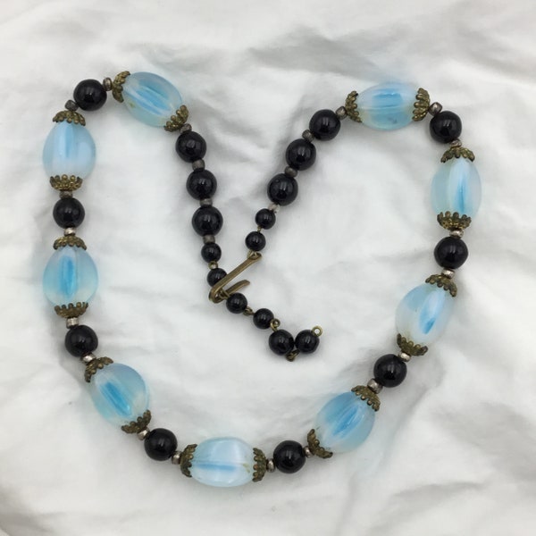 Vintage West Germany signed 1950 to 1960s white blue opaline glass black glass bead brass caps & clasp short necklace. Adjustable length.