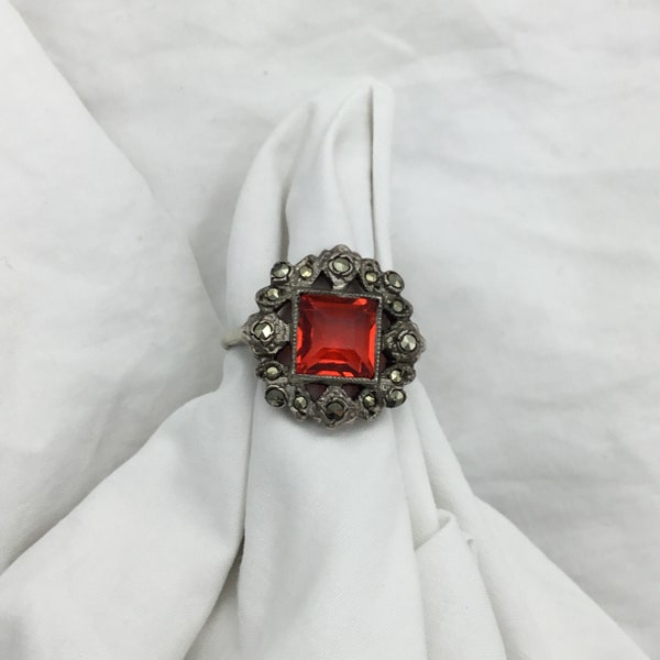 Art Deco C1930s to 1940s ruby red glass 8mm and Silver and 17mm marcasite cluster square ring. Size UK M, US 6.5, EU 52.5. Good condition