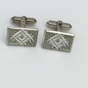 Vintage silver rectangular cufflinks C1970s. Modernist diamond cut design. Size 2.2cm x 14mm wide. Weight 12g quite heavy. In good condition
