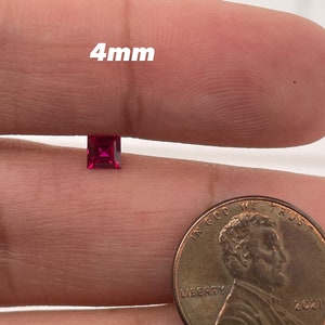 May include: A 4mm square-shaped ruby gemstone, shown next to a US penny for size comparison.