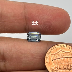 Lab Grown Moissanite Blue Grey Color Emerald Cut Eye Clean DEF Color Available in 8x6mm Size.