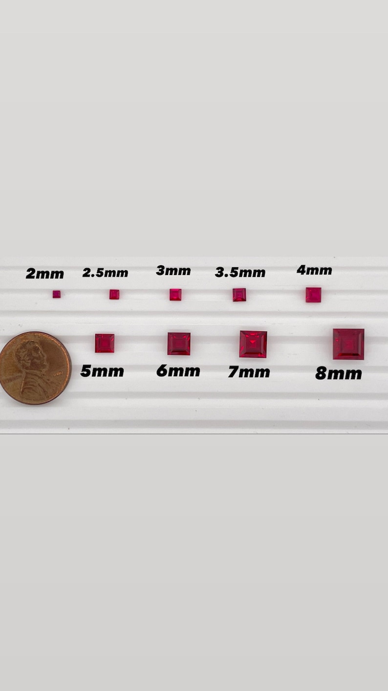 May include: Size comparison of red square-shaped gemstones, ranging from 2 mm to 8 mm. The gemstones are arranged in two rows on a white surface. A US penny is included for scale.