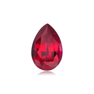 May include: A pear-shaped ruby gemstone with a deep red color. The gemstone is faceted and has a high polish.