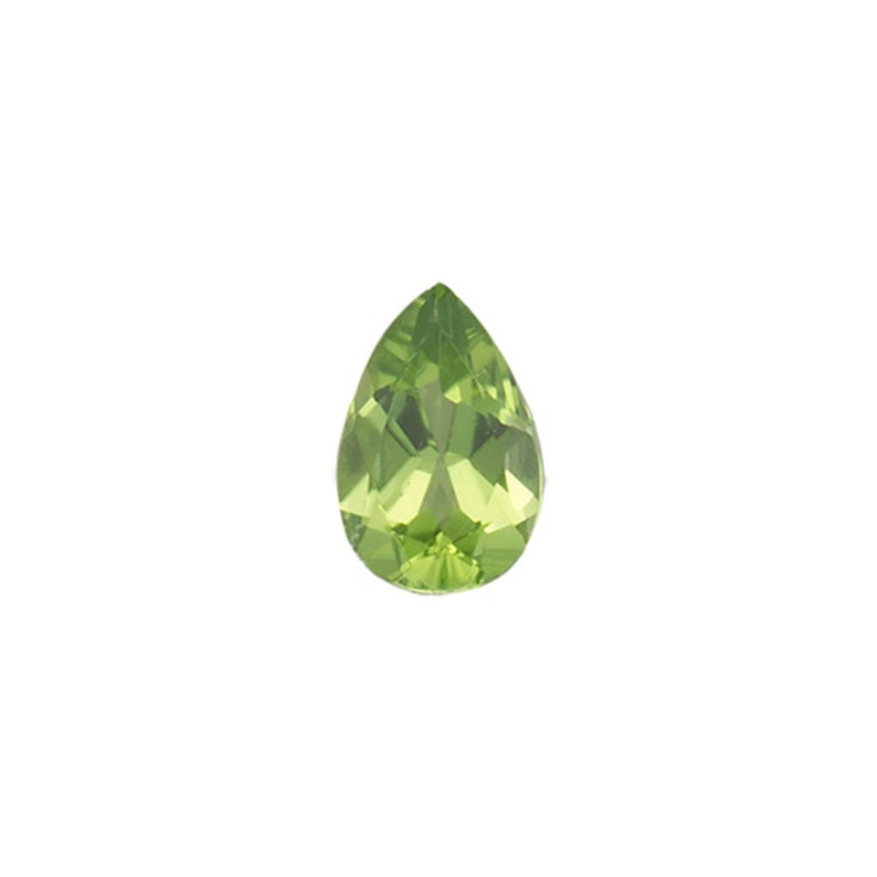 May include: A pear-shaped green gemstone with facets.