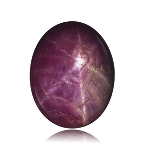May include: A deep pink star ruby gemstone with a six-pointed star in the center. The stone is oval shaped and has a smooth, polished surface.