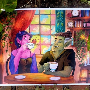 May include: A colorful illustration depicts two fantasy characters enjoying tea at a table. The woman, with purple skin and horns, sips from a teacup. The man, with green skin and pointed ears, smiles. The background features a window and a shelf with books.