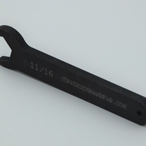 May include: A black 11/16 inch wrench with the text "YODERTOOLMFG.COM" engraved on the handle.