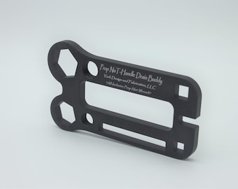 May include: Black metal tool with a T-handle and multiple wrench sizes. The tool is labeled "Prop NuT-Handle Drain Buddy" and "York Designs and Fabrication, LLC".