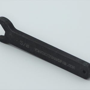 May include: A black 5/8 inch wrench with the text "MAGESTICMANOFAS.COM" engraved on the handle.