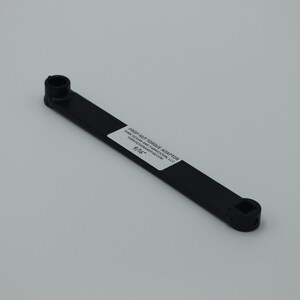 May include: Black plastic prop nut torque adapter with the text "PROP NUT TORQUE ADAPTER" and "FOR STANDARD AND MODIFIED 1.75" CONVERSION NUTS" and "9/16" printed on it.