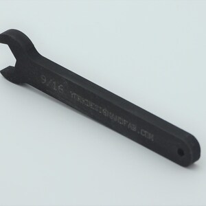 May include: A black wrench with a 9/16 inch size marking and the text "YTREXS.GRAVITYAB.COM" on the handle.