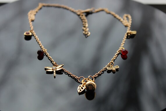 Gold Apple necklace with pomegranate seeds bee and dragonfly