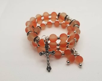 Lutheran rosary bracelet, Lutheran prayer bracelet, memory wire bracelet, wrap bracelet, orange rubberized  glass beads, budded crucifix