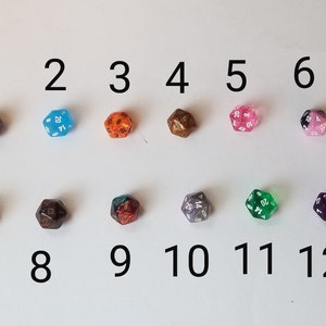May include: Twelve 20-sided dice in various colors and patterns, numbered 1 through 12.