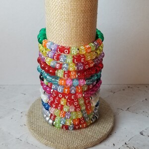 Sets of 12 friendship bracelets, beaded Swiftie bracelets, Eras themed friendship bracelets, stretchy bracelets, swappable concert bracelets