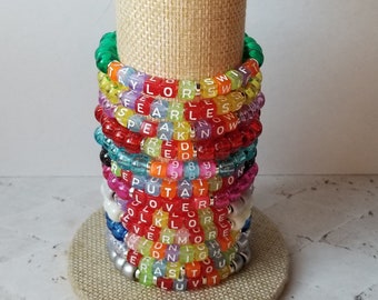 Sets of 12 friendship bracelets, beaded Swiftie bracelets, Eras themed friendship bracelets, stretchy bracelets, swappable concert bracelets