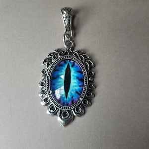 Dragon eye pendant, dragon eye necklace, silver-toned frames, cat eye jewelry, demon eye pendant, glass eye cabochons, aqua or blue eyes