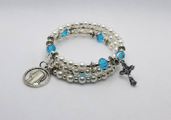 Bracelet, Catholic five decade memory wire bracelet, silver tone, off white glass pearls, blue glass rondelles, religious medal, crucifix