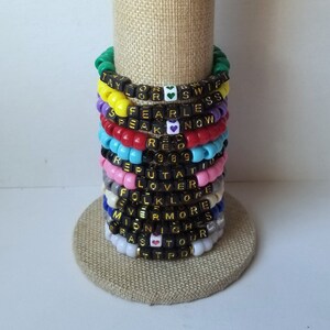 Sets of 12 friendship bracelets, beaded Swiftie bracelets, Eras themed friendship bracelets, stretchy bracelets, swappable concert bracelets