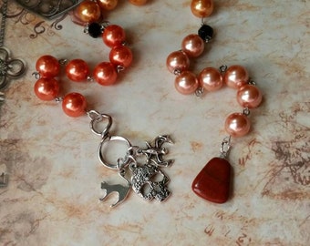 Samhain prayer beads, pagan prayer beads, Samhain witches prayer beads, stainless steel, glass pearls, Red Jasper, three spooky charms