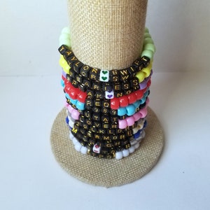Sets of 12 friendship bracelets, beaded Swiftie bracelets, Eras themed friendship bracelets, stretchy bracelets, swappable concert bracelets