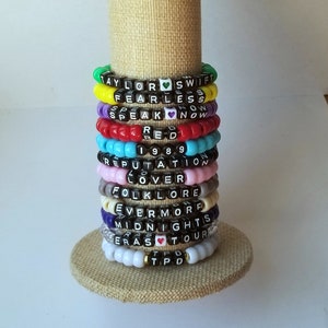 Sets of 12 friendship bracelets, beaded Swiftie bracelets, Eras themed friendship bracelets, stretchy bracelets, swappable concert bracelets
