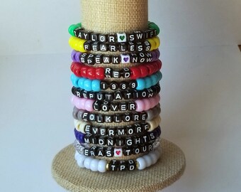 Sets of 12 friendship bracelets, beaded Swiftie bracelets, Eras themed friendship bracelets, stretchy bracelets, swappable concert bracelets