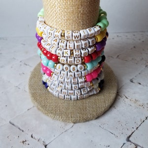 Sets of 10 friendship bracelets, beaded Swiftie bracelets, Eras themed friendship bracelets, stretchy bracelets, swappable concert bracelets