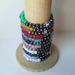 Sets of 12 friendship bracelets, beaded Swiftie bracelets, Eras themed friendship bracelets, stretchy bracelets, swappable concert bracelets