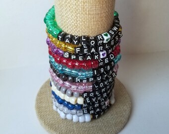 Sets of 12 friendship bracelets, beaded Swiftie bracelets, Eras themed friendship bracelets, stretchy bracelets, swappable concert bracelets