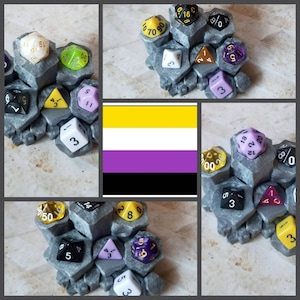 May include: A gray, multi-sided dice tower with a variety of colorful dice, including yellow, purple, white, and black. The dice tower is made of a textured material and has a variety of different shapes and sizes.