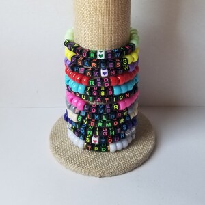 Sets of 12 friendship bracelets, beaded Swiftie bracelets, Eras themed friendship bracelets, stretchy bracelets, swappable concert bracelets