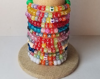 Sets of 12 friendship bracelets, beaded Swiftie bracelets, Eras themed friendship bracelets, stretchy bracelets, swappable concert bracelets