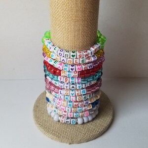 Sets of 12 friendship bracelets, beaded Swiftie bracelets, Eras themed friendship bracelets, stretchy bracelets, swappable concert bracelets