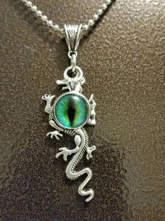 Fantasy dragon necklace dragon eye pendant, silver toned with long dragon charm and brilliant green glass dragon's eye cabochon