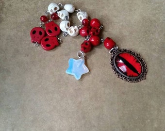 Day of the Dead prayer beads, Dia de Los Muertos prayer beads, pagan prayer beads, stainless steel, red and ivory skulls, Opalite, red eye