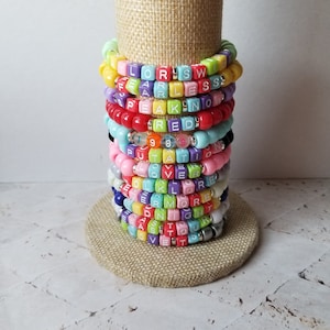 Sets of 12 friendship bracelets, beaded Swiftie bracelets, Eras themed friendship bracelets, stretchy bracelets, swappable concert bracelets