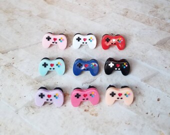 Pin backs, hat pins, lapel pins, pinbacks, gaming pins, gamer pinbacks, geeky pins, gaming controller pinbacks, double posts, rubber backs
