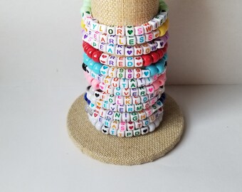 Sets of 12 friendship bracelets, beaded Swiftie bracelets, Eras themed friendship bracelets, stretchy bracelets, swappable concert bracelets