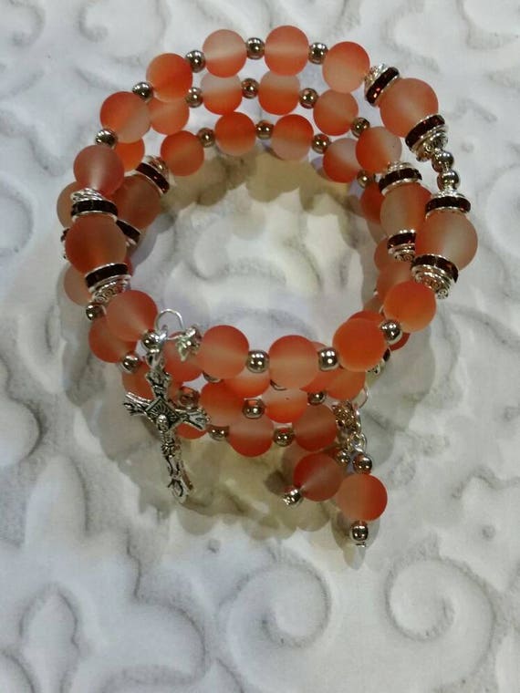 Lutheran rosary bracelet, Lutheran prayer bracelet, memory wire bracelet, wrap bracelet, orange rubberized glass beads, budded crucifix