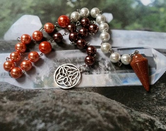 Lammas prayer beads, pagan prayer beads, Lughnasadh prayer beads, stainless steel, glass pearls, Goldstone pendulum, Celtic knotwork charm