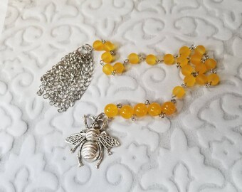 Baha'i prayer beads, 19 and 5 prayer beads, hand-wired, stainless, yellow sea glass, butterscotch Malay Jade, bee charm, handmade tassel