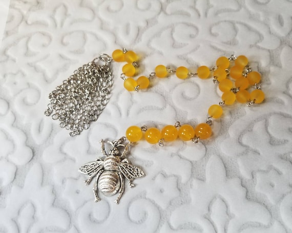 Baha'i prayer beads, 19 and 5 prayer beads, hand-wired, stainless, yellow sea glass, butterscotch Malay Jade, bee charm, handmade tassel